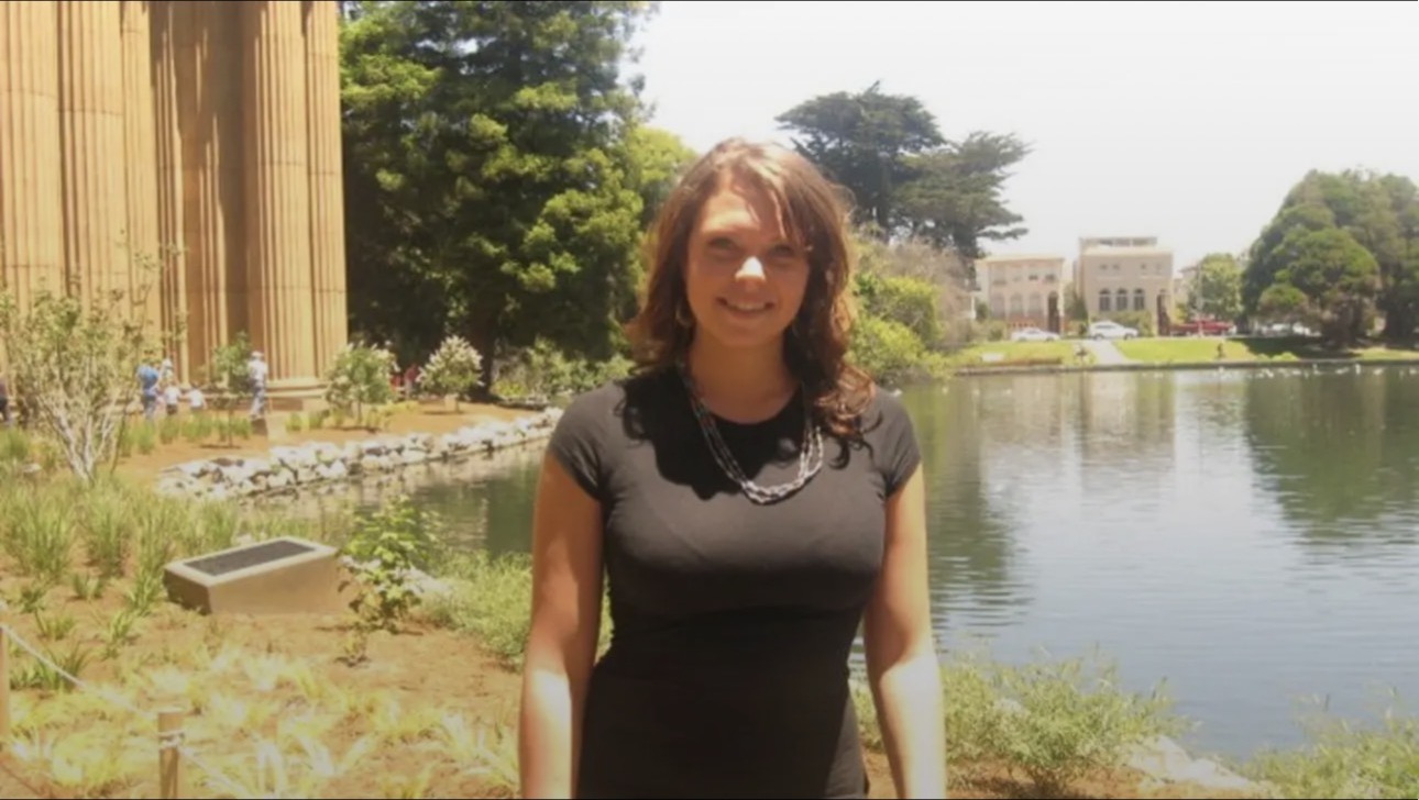 Katie before the program, standing outdoors in a black top